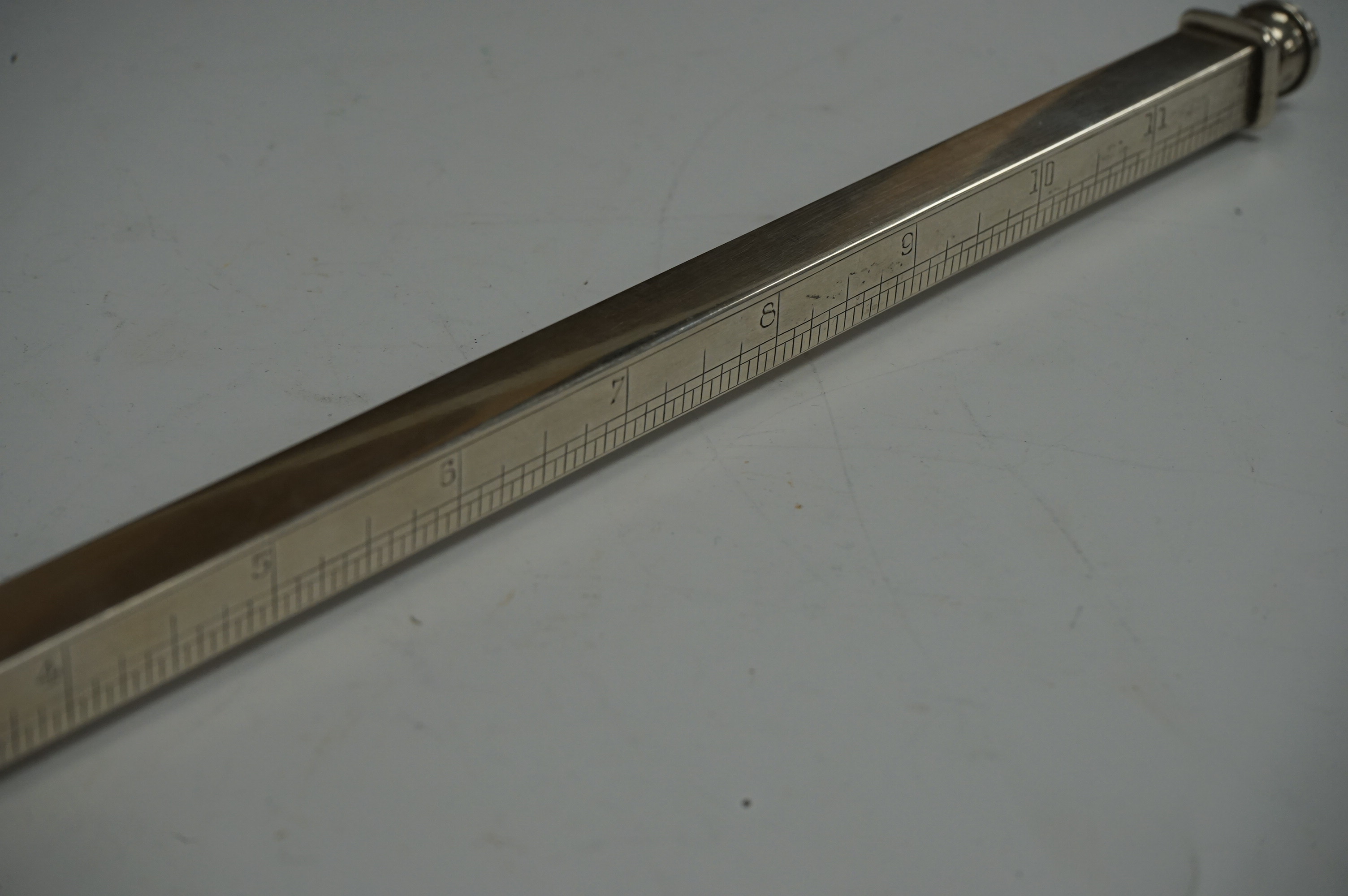 An Edwardian novelty silver twelve inch ruler and double ended pencil holder, by Jordan & Raybould, London, 1903, 33.5cm. Condition - fair to good